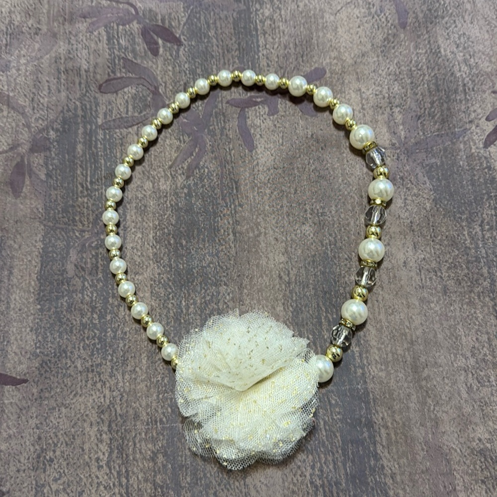 Beaded headband. Stretches.